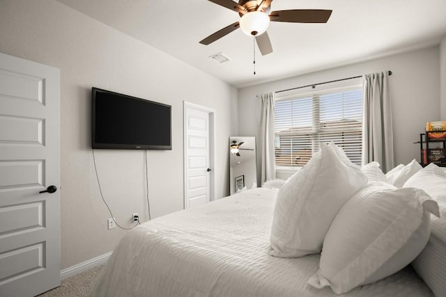 bedroom featuring ceiling fan and carpet flooring