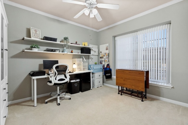 carpeted home office featuring ceiling fan and ornamental molding