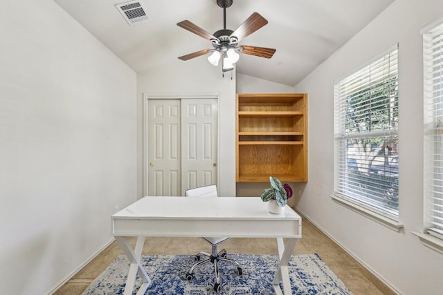 office space with ceiling fan, lofted ceiling, and light colored carpet