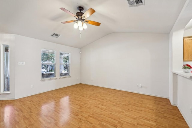 unfurnished living room featuring light hardwood / wood-style flooring, ceiling fan, and vaulted ceiling