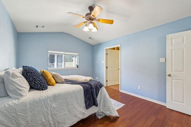 bedroom with vaulted ceiling, hardwood / wood-style floors, and ceiling fan