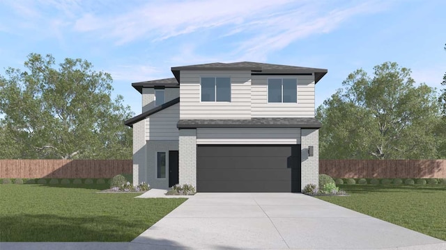 view of front of home featuring a garage and a front yard