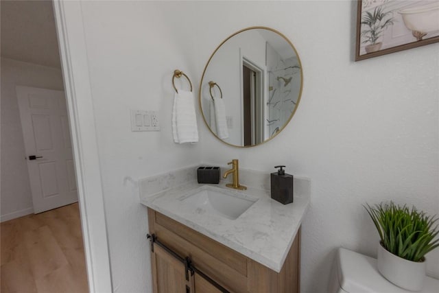 bathroom featuring vanity and hardwood / wood-style floors