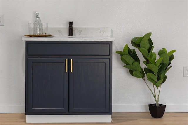 room details featuring sink and hardwood / wood-style floors