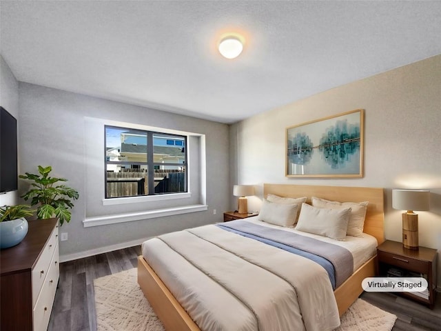 bedroom featuring dark hardwood / wood-style floors