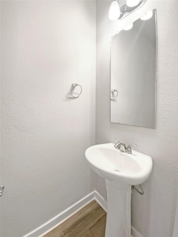 bathroom featuring hardwood / wood-style flooring