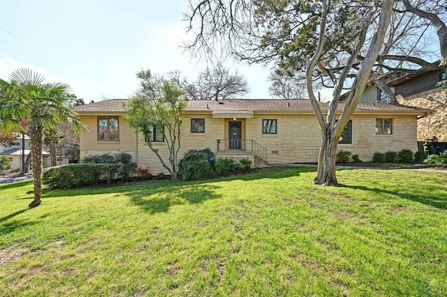 rear view of property featuring a yard