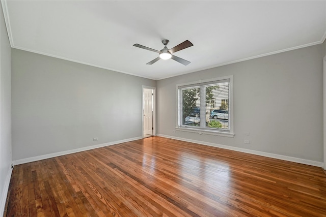 spare room with hardwood / wood-style flooring, crown molding, and ceiling fan