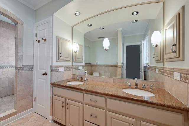 bathroom with tile walls, vanity, and ornamental molding