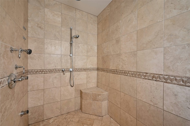 bathroom with tiled shower