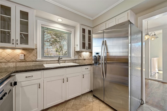 kitchen featuring sink, stainless steel appliances, and white cabinets