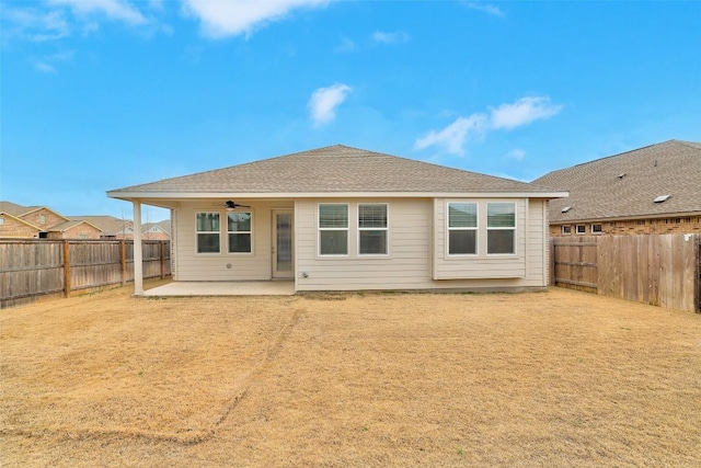 rear view of property with a patio and ceiling fan