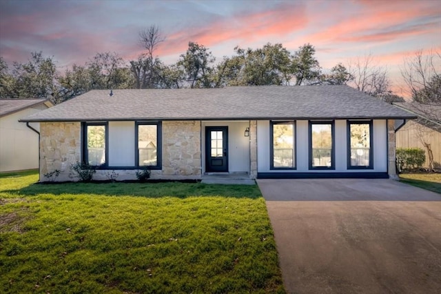 ranch-style house with a lawn