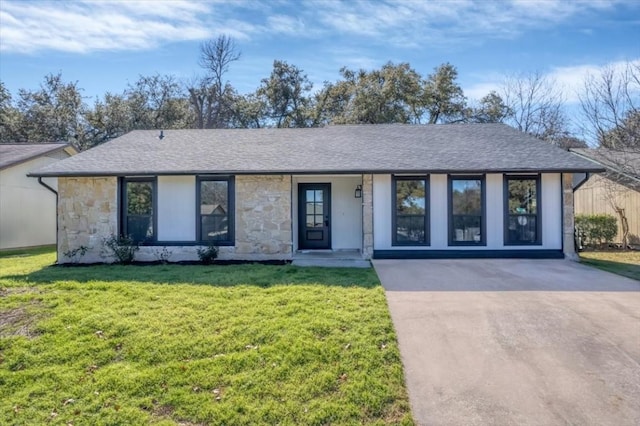 ranch-style home with a front yard