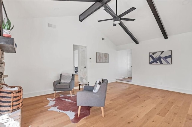 sitting room featuring beam ceiling, hardwood / wood-style flooring, high vaulted ceiling, and ceiling fan