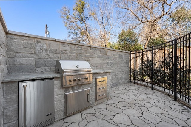 view of patio / terrace with a grill and exterior kitchen