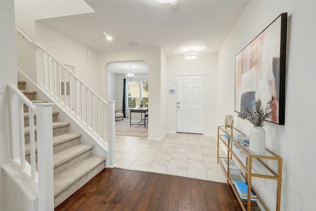 foyer entrance with light hardwood / wood-style floors