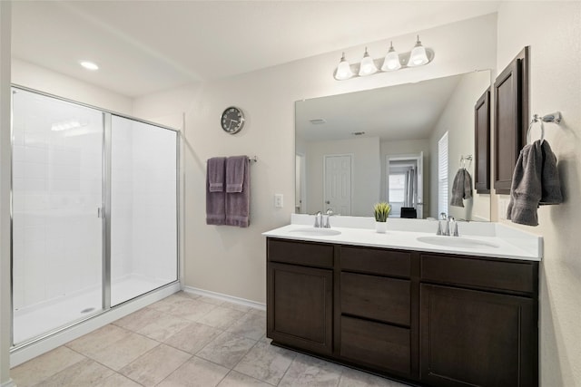 bathroom with walk in shower and vanity