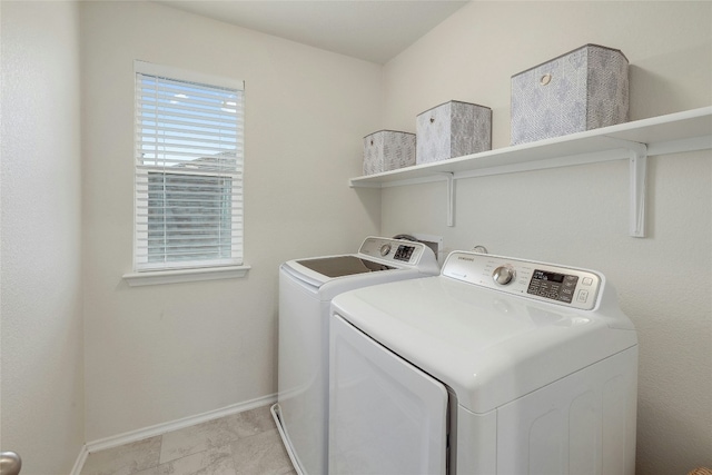 laundry room featuring washing machine and dryer