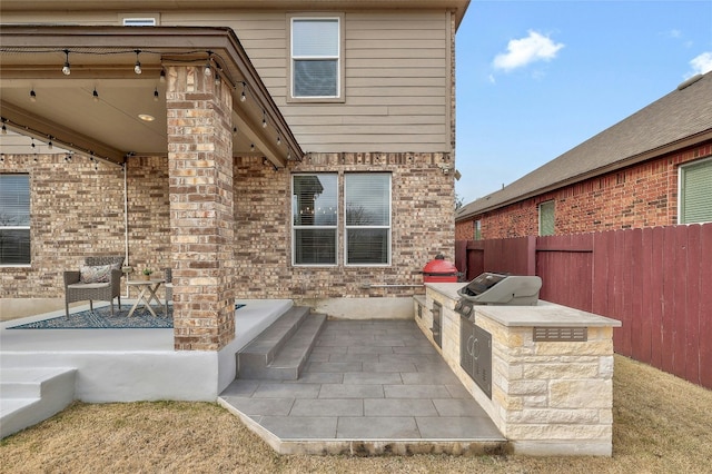 view of patio / terrace featuring a grill and area for grilling