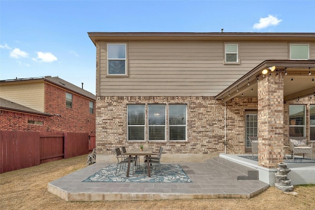 rear view of property featuring a patio