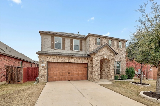 view of front facade with a garage and a front yard