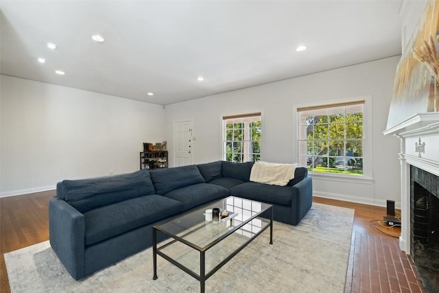2612 Bridle Path, Austin, TX 78703 - living area featuring a fireplace with flush hearth, wood finished floors, baseboards, and recessed lighting