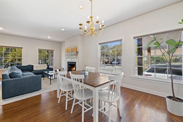 2612 Bridle Path, Austin, TX 78703 - dining room with baseboards, healthy amount of natural light, dark wood-style floors, a warm lit fireplace, and recessed lighting