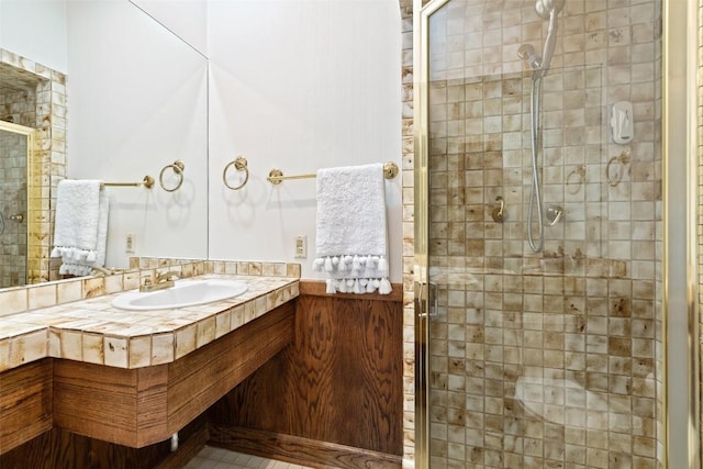 bathroom with an enclosed shower and vanity