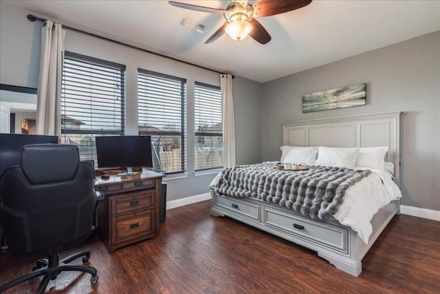 bedroom with dark hardwood / wood-style floors and ceiling fan