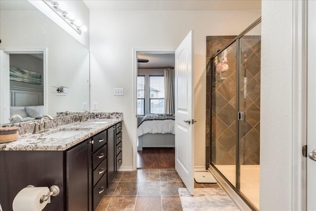 bathroom with walk in shower and vanity