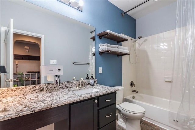 full bathroom featuring shower / tub combo, vanity, and toilet