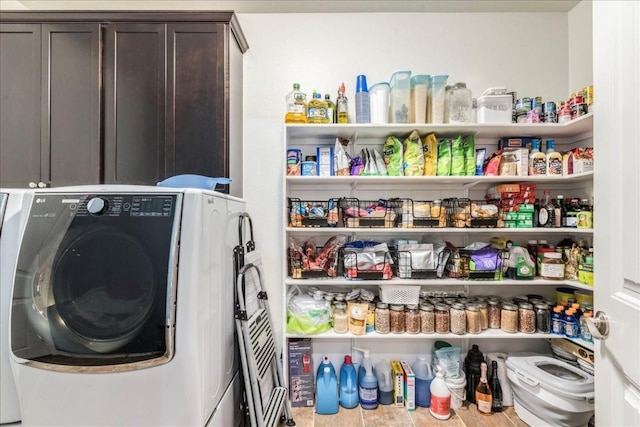 interior space with washer / clothes dryer and cabinets