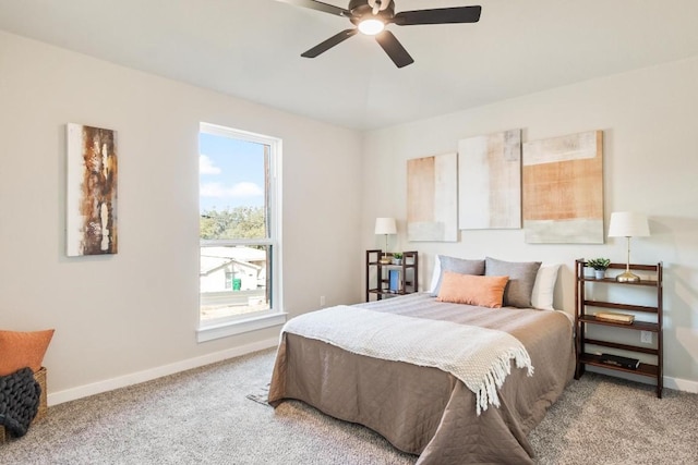 bedroom featuring ceiling fan and carpet