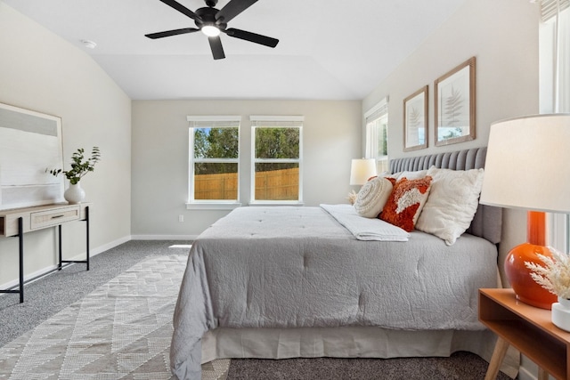 bedroom featuring vaulted ceiling, light carpet, and ceiling fan