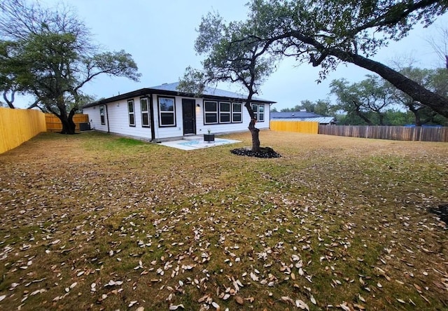 exterior space with a patio and a front lawn