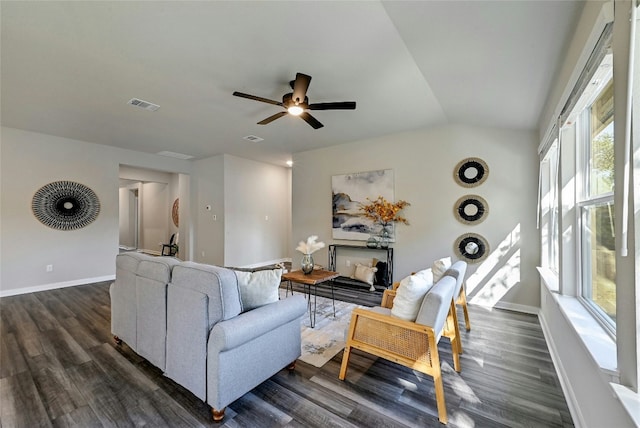 living room featuring ceiling fan, dark hardwood / wood-style floors, and lofted ceiling