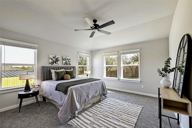 bedroom with multiple windows, vaulted ceiling, carpet, and ceiling fan