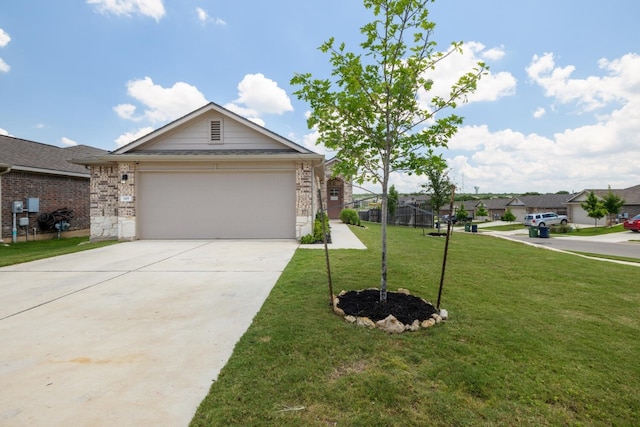 single story home featuring a garage and a front yard