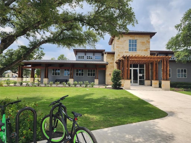 rear view of property with a yard and a pergola