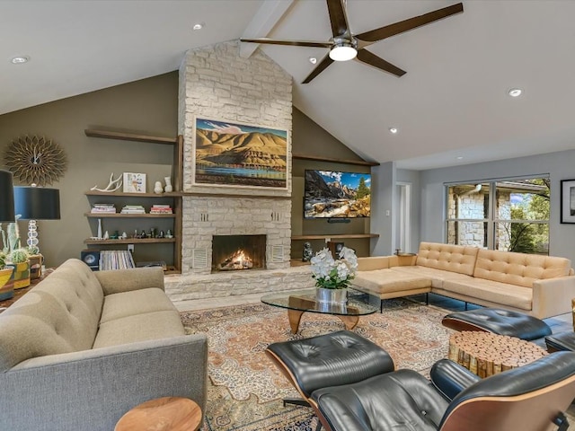 living room featuring ceiling fan, vaulted ceiling with beams, and a fireplace