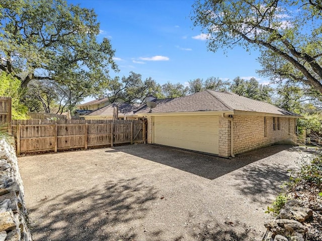 view of side of home with a garage