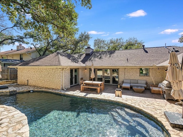 back of house with an outdoor hangout area and a patio area