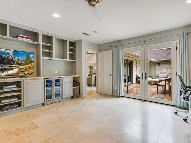 bar featuring french doors, ceiling fan, built in features, and wine cooler