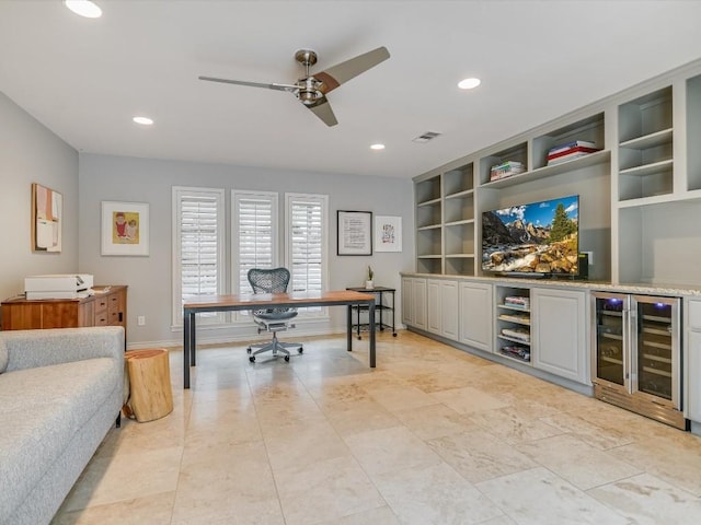 office space featuring ceiling fan, beverage cooler, and built in features