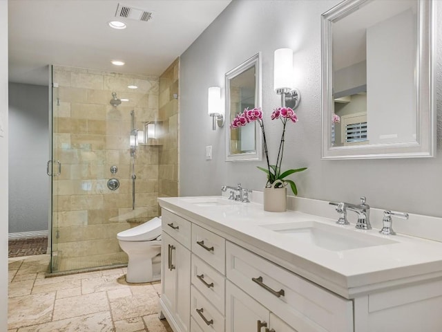 bathroom featuring toilet, vanity, and walk in shower