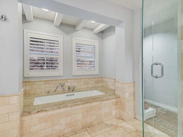 bathroom with a shower with shower door and beamed ceiling