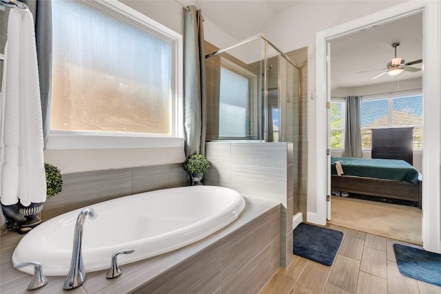 bathroom with separate shower and tub