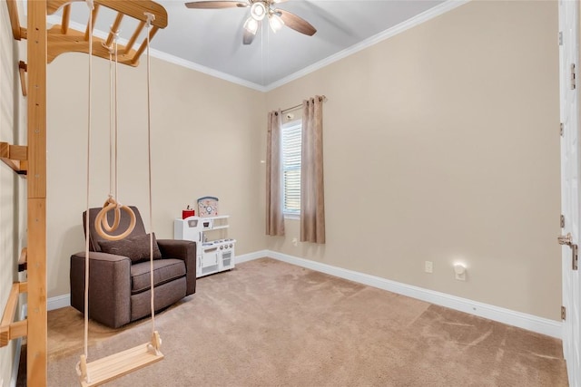 living area with crown molding, ceiling fan, and carpet flooring