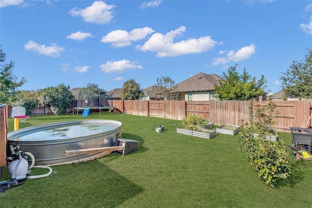 view of yard featuring a trampoline